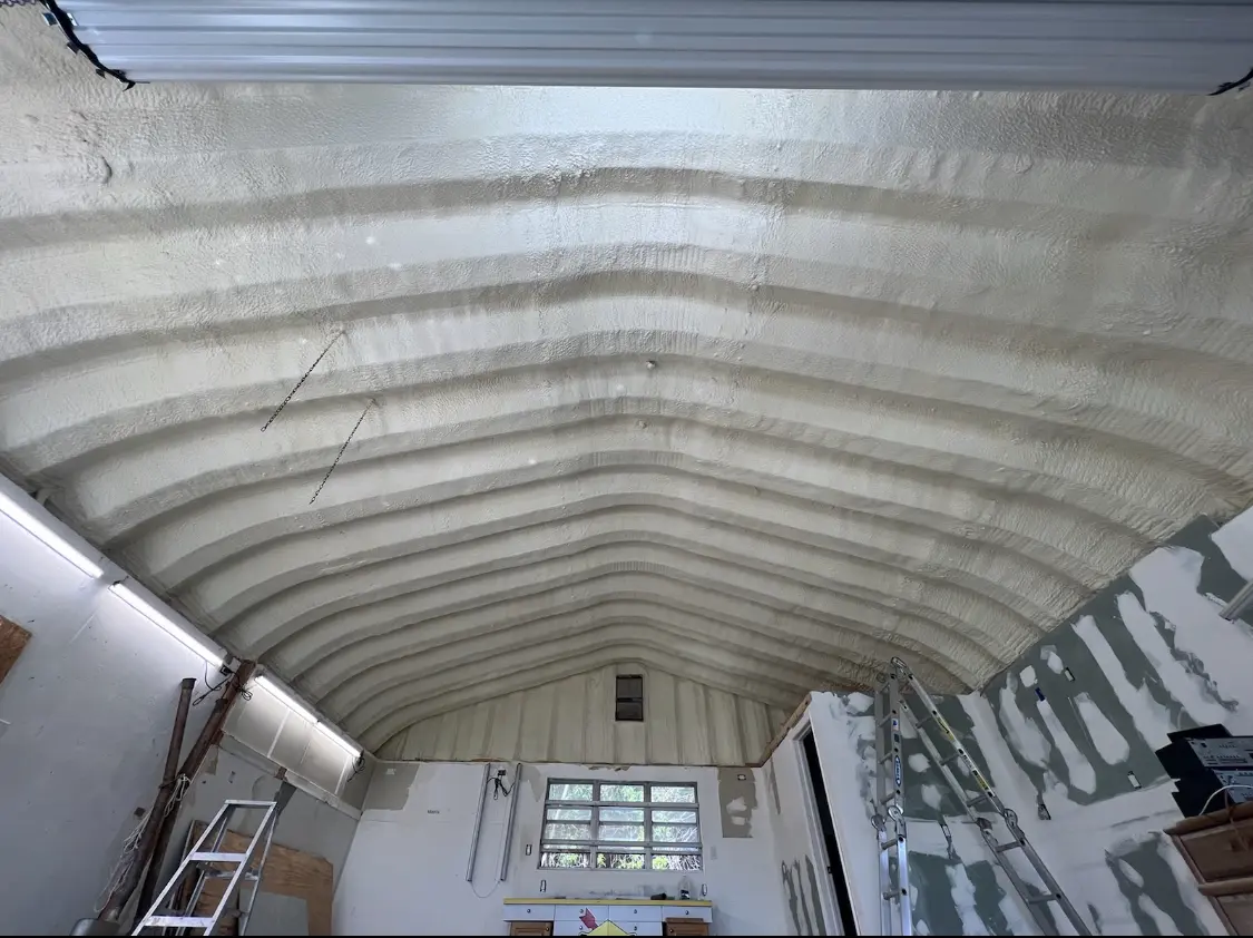 Spray polyurethane foam applied to the underside of a metal roof deck in New Philadelphia
